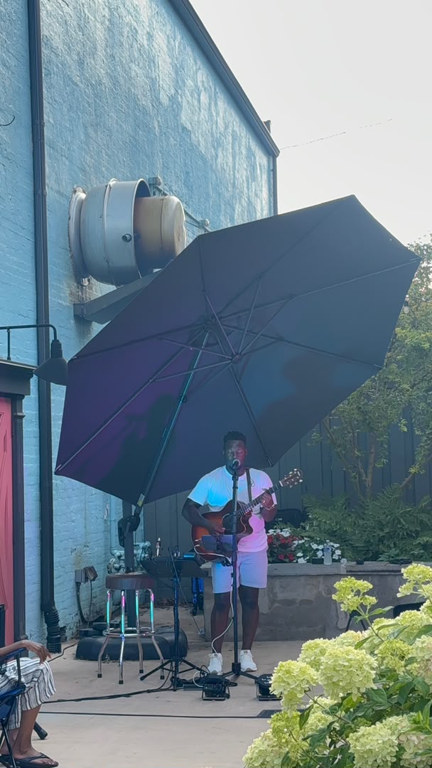 Worship leader singing with eyes closed
